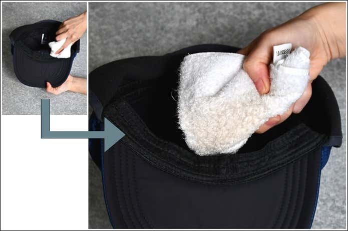 キャップのおでこ部分を「Hat Care Kit」でケアし、タオルでふき取ると白いタオルに汚れが移って茶色くなった場面